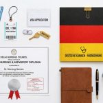 A neat stack of important nursing documents with an apostille stamp on a desk